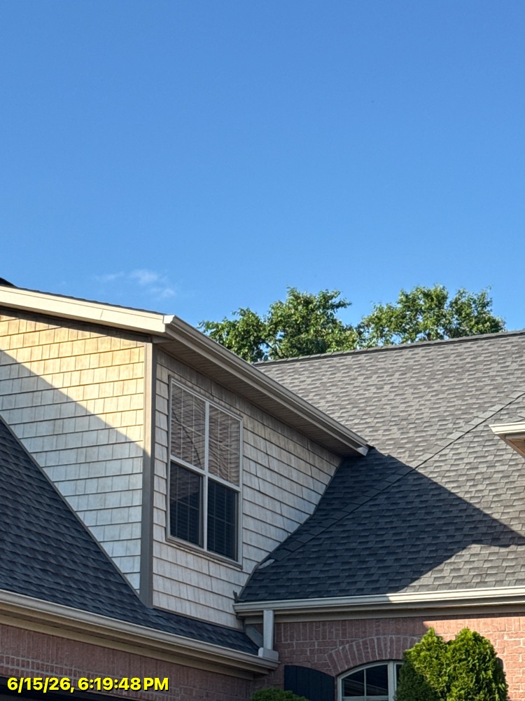 Brothers Gutters Solutionist at work on a Northwest Arkansas home