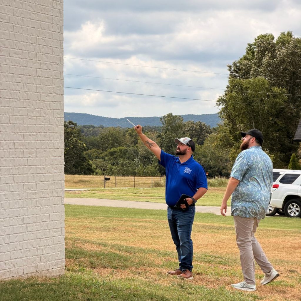The Brothers That Just Do Gutters truck on a Northwest Arkansas job