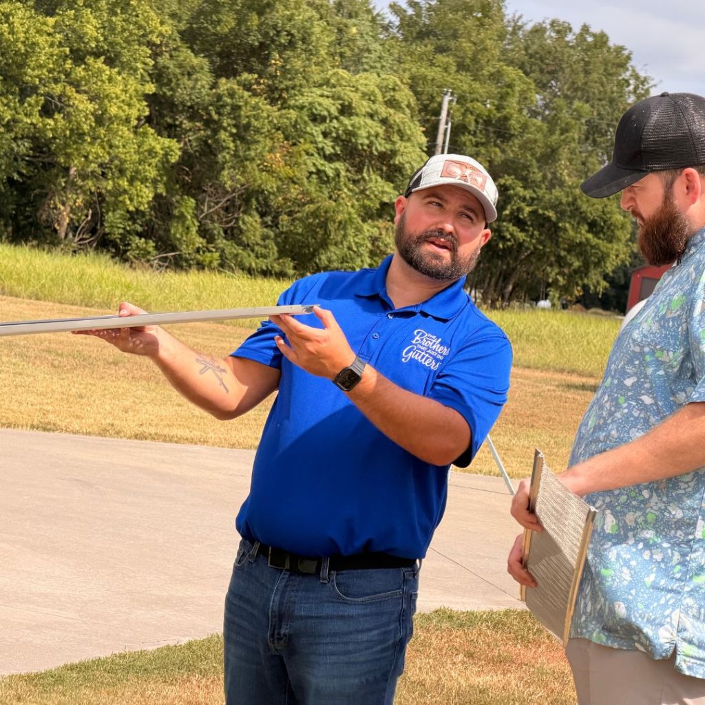 Brothers Gutters Northwest Arkansas Solutionist walking a homeowner through the estimate