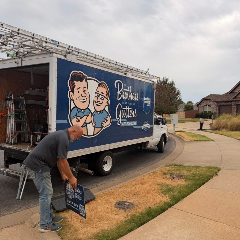 Brothers Gutters Solutionist at work on a Northwest Arkansas home