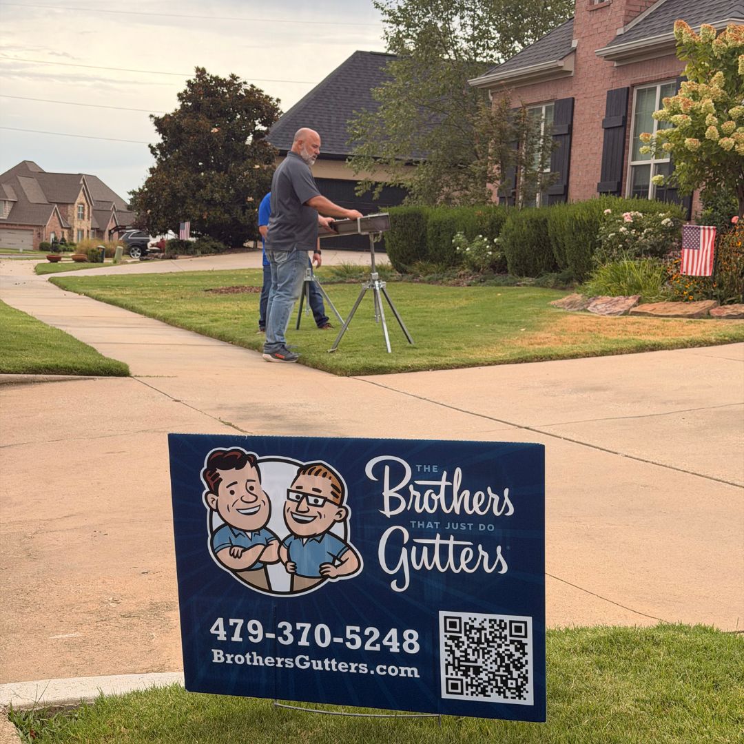 Setting up the gutter stand on the front lawn